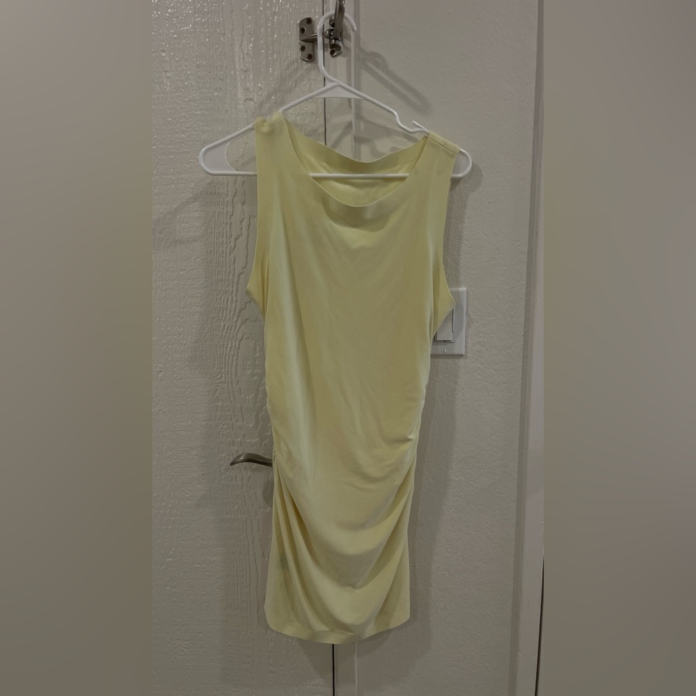 Norma Kamali pickleball mini dress in butter yellow